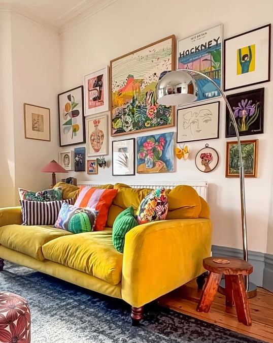 Mustard Velvet Sofa with Floor-to-Ceiling Gallery Wall