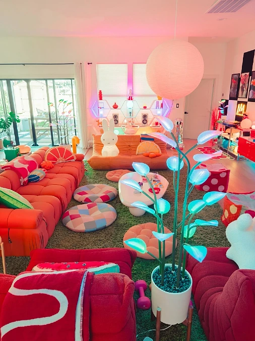 Neon-Lit Living Room with Colorful Floor Cushions