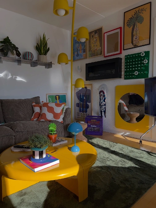 Yellow Curved Floor Lamp and Molded Plastic Coffee Table