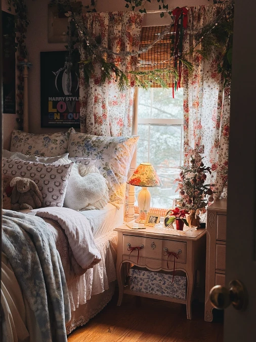 Floral Window Bedroom with Layered Cotton Bedding and Warm Lamp Glow