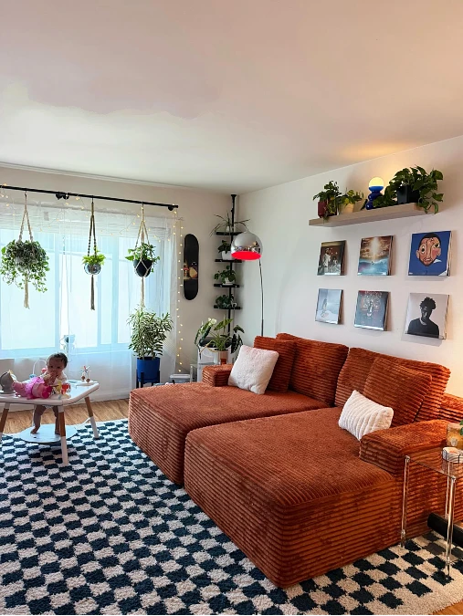 Rust Corduroy Sofa with Graphic Checkered Rug