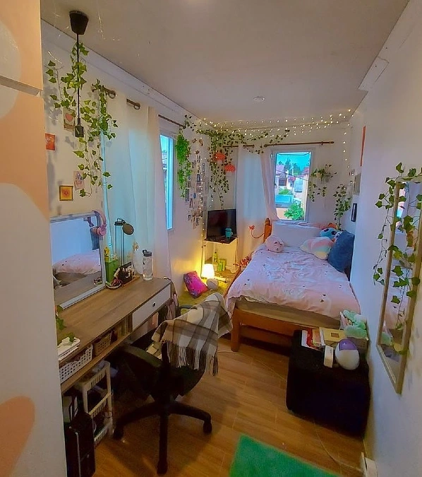 Eclectic Cozy Bedroom with Hanging Plants and Fairy Light Ceiling