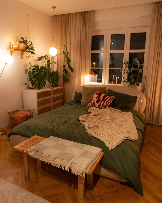 Deep Green Bedding Bedroom with Warm Ambient Globe Lighting