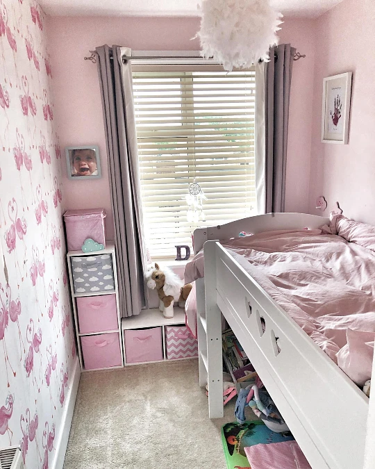 Raised Storage Bed with Flamingo Wallpaper Wall