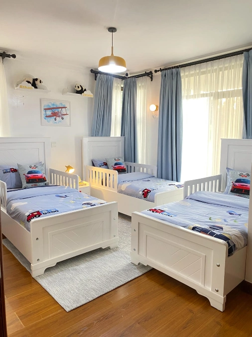 Triple Single Beds With Light Blue Window Wall Setup