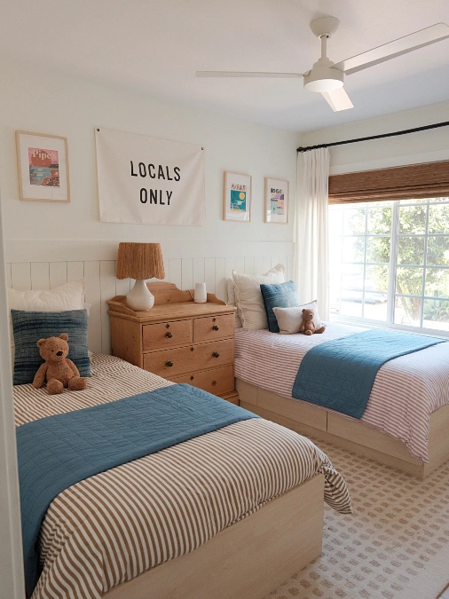 Twin Beds With Central Wooden Dresser and Coastal Style Decor