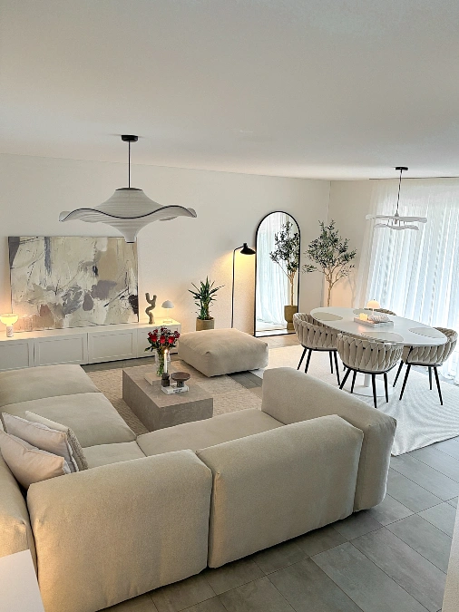 Wave Pendant Lights Over a Soft Cream Living Room