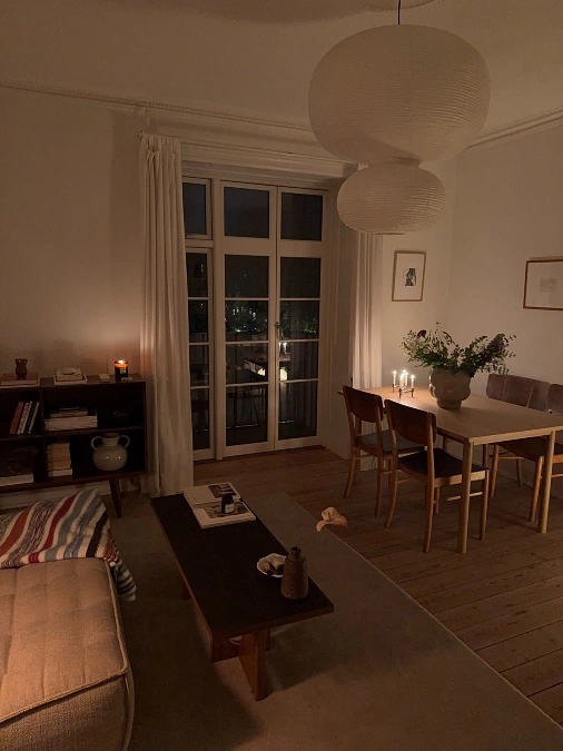Paper Lantern Pendants Over a Candlelit Dining Corner