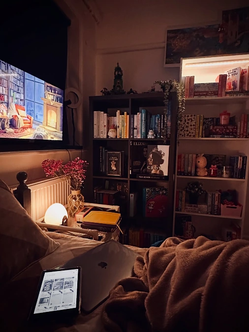 Cozy Bedside Library With Movie Glow