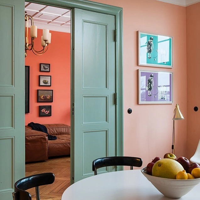 Peach Dining Room with Sage Green Pocket Doors