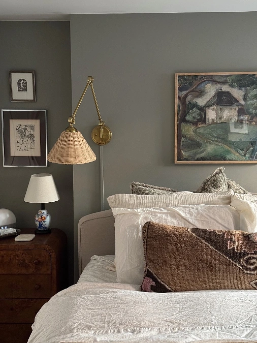 Muted Sage Bedroom Accent Wall with Woven Sconce