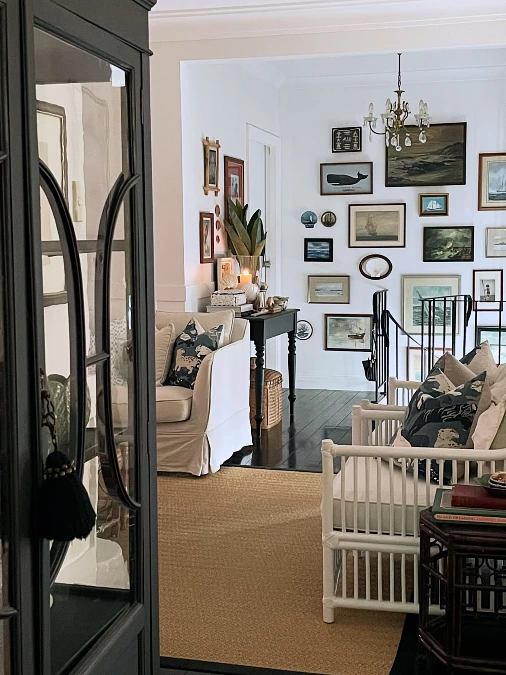 Collected Coastal Gallery Wall in a Narrow Hallway