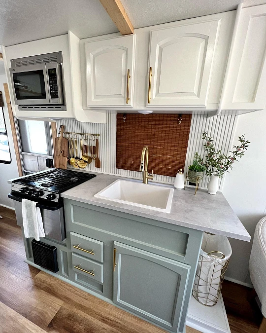 Sage Cabinetry with Brass Details