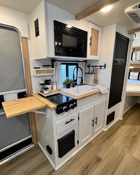 White Cabinets + Fold-Down Prep Shelf + Black Fixtures