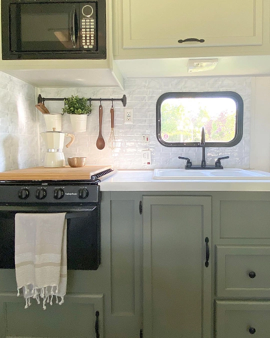 Soft Sage Cabinets and Glossy Tile