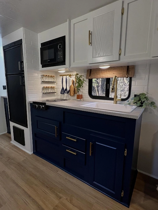 Navy Lower Cabinets and Brass Accents