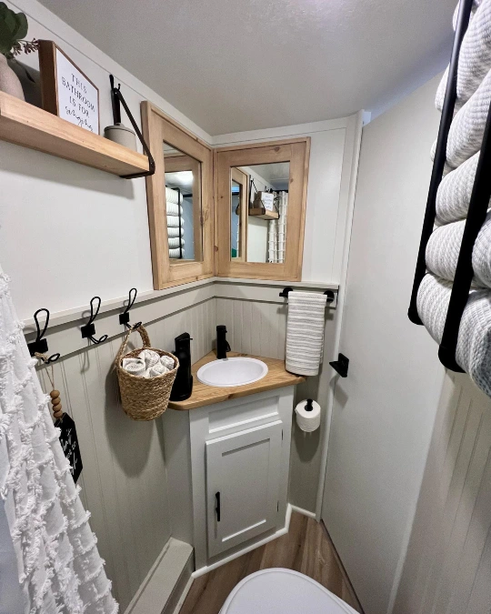 Corner Vanity with Wrapped Mirrors