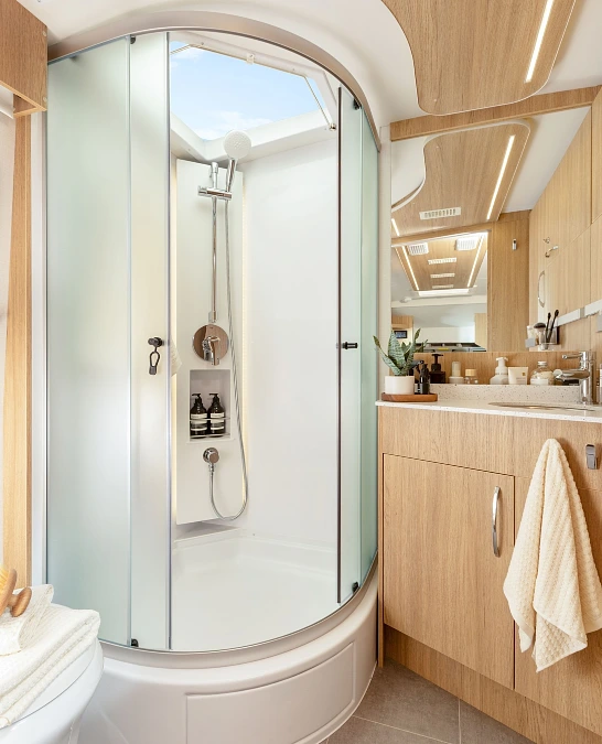 Curved Shower + Light Oak Vanity