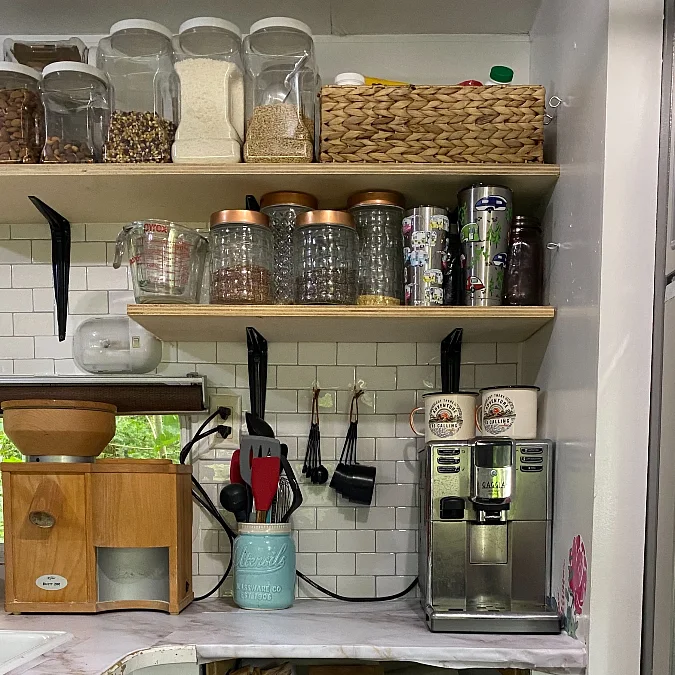 Open Pantry Shelves Above a Coffee Station
