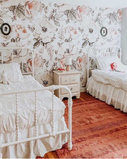 Vintage Metal Beds with Floral Wallpaper