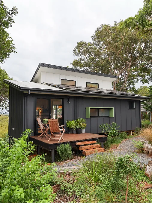 Black Cabin with Wood Deck