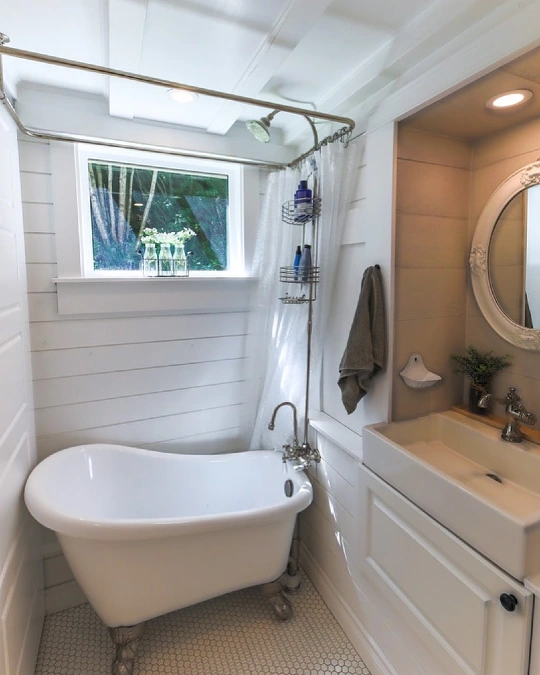 Clawfoot Tub Beside a Compact Vanity